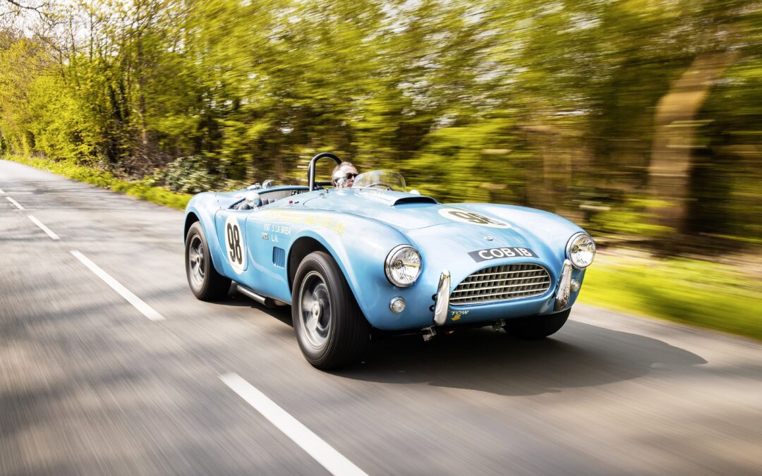 man driving the Shelby Cobra