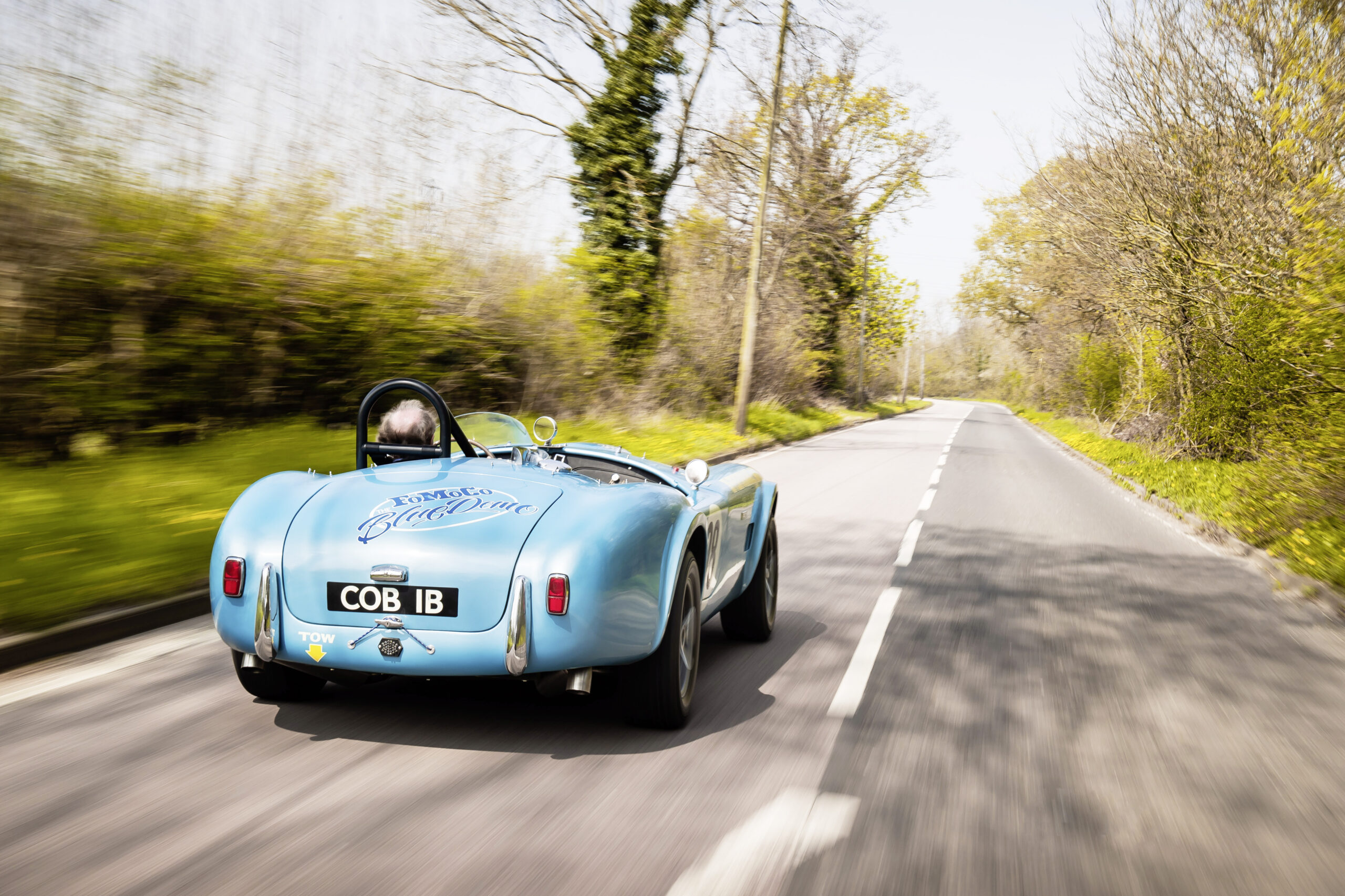 man driving the Shelby Cobra