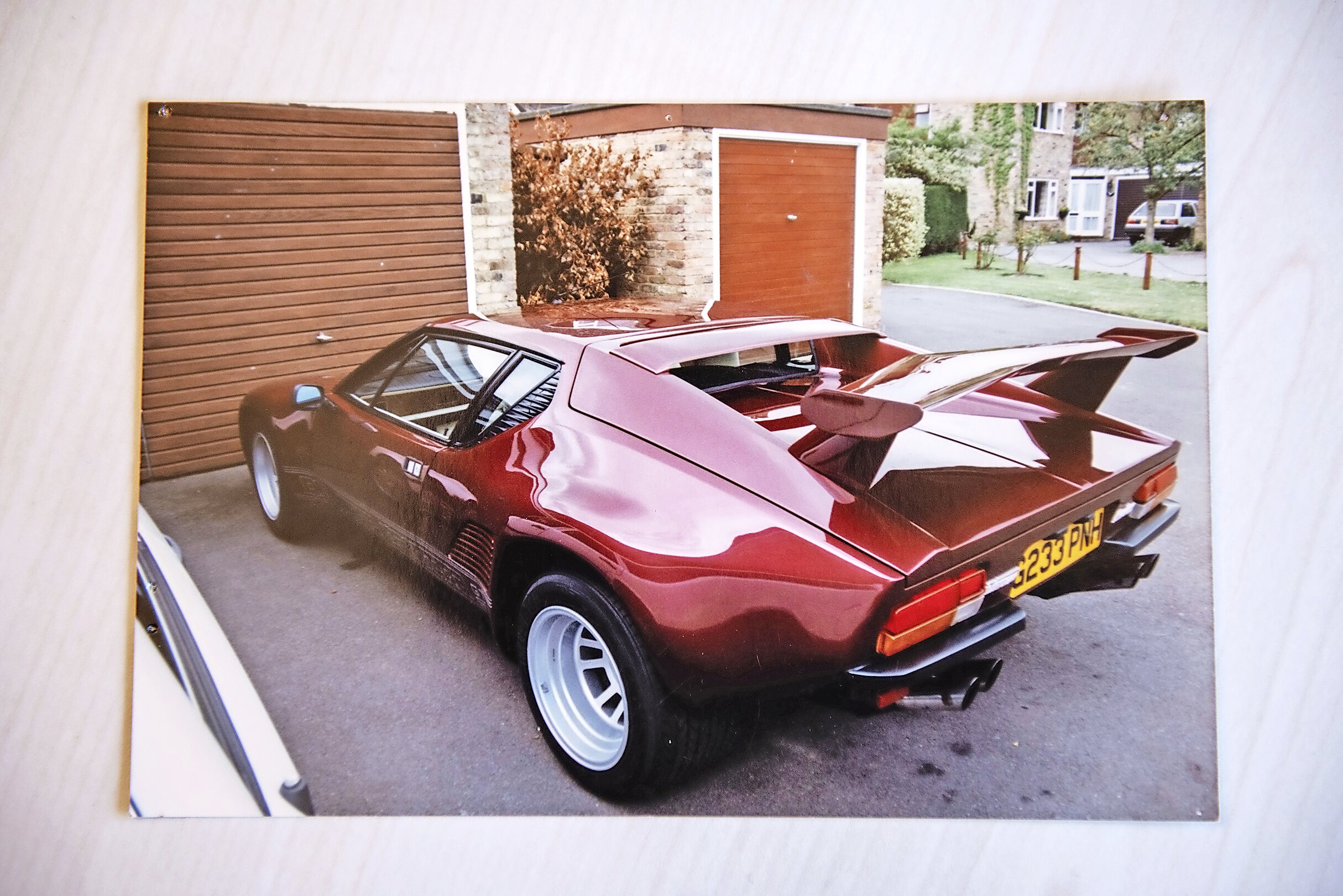 De Tomaso Pantera GT5S parked outside a garage