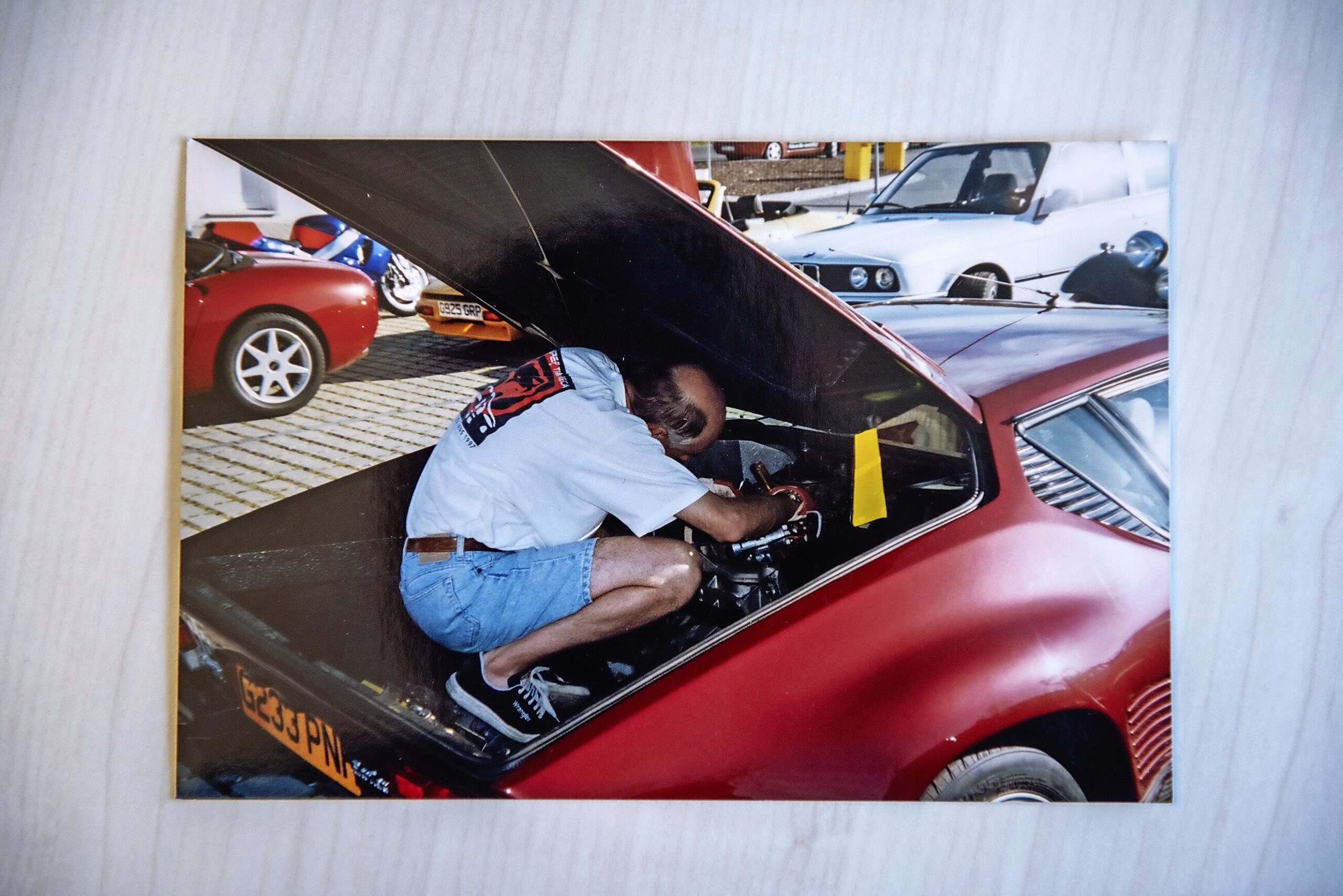 Man fixing the De Tomaso Pantera GT5S engine