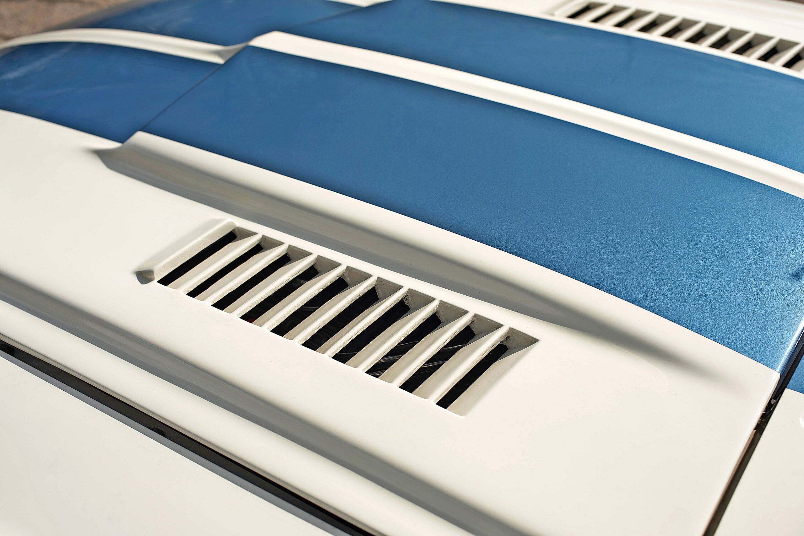 Cooling vents in glassfibre bonnet are functional,
and necessary