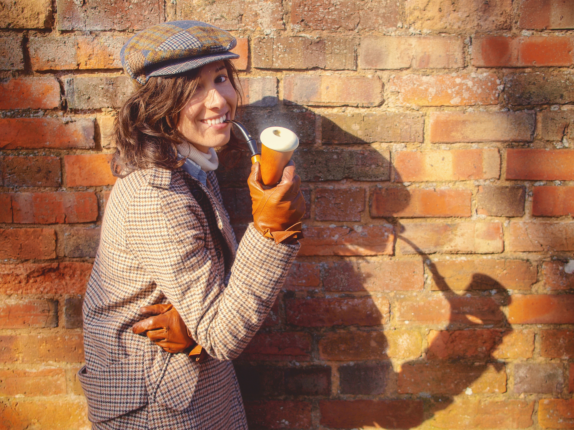 Stylish woman smoking pipe