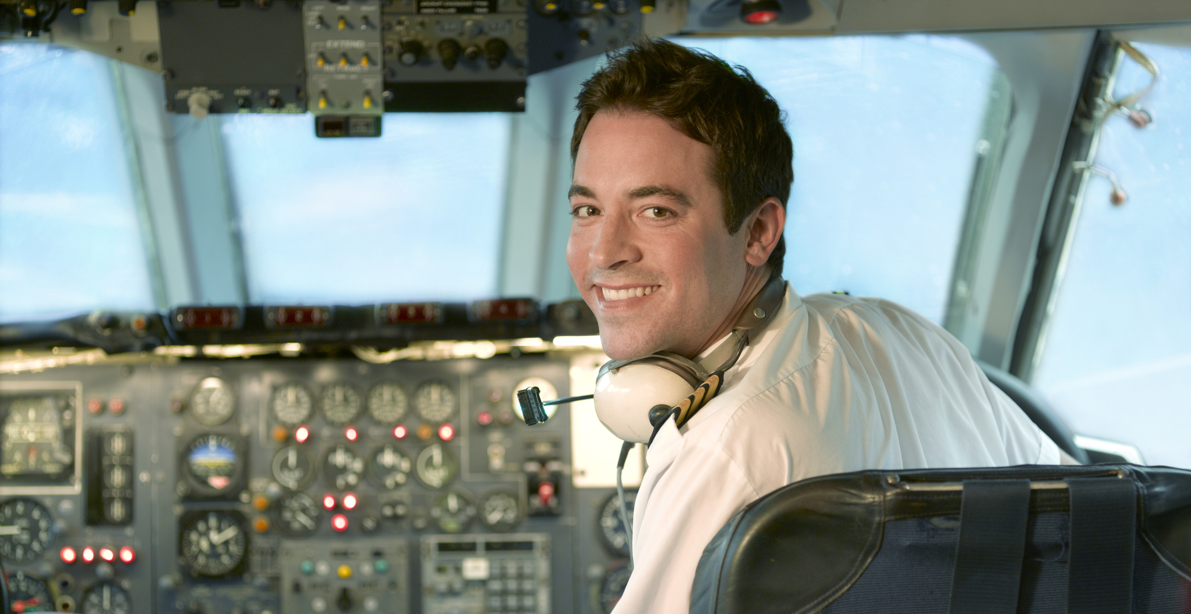 Pilot at control of jet aeroplane