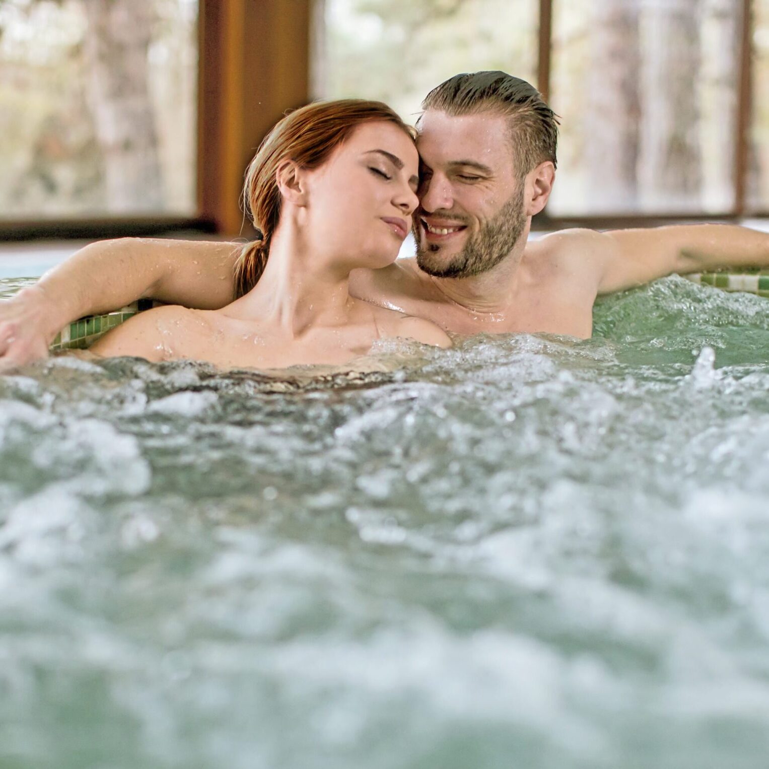 Loving,Couple,Relaxing,In,Hot,Tub,In,Spa