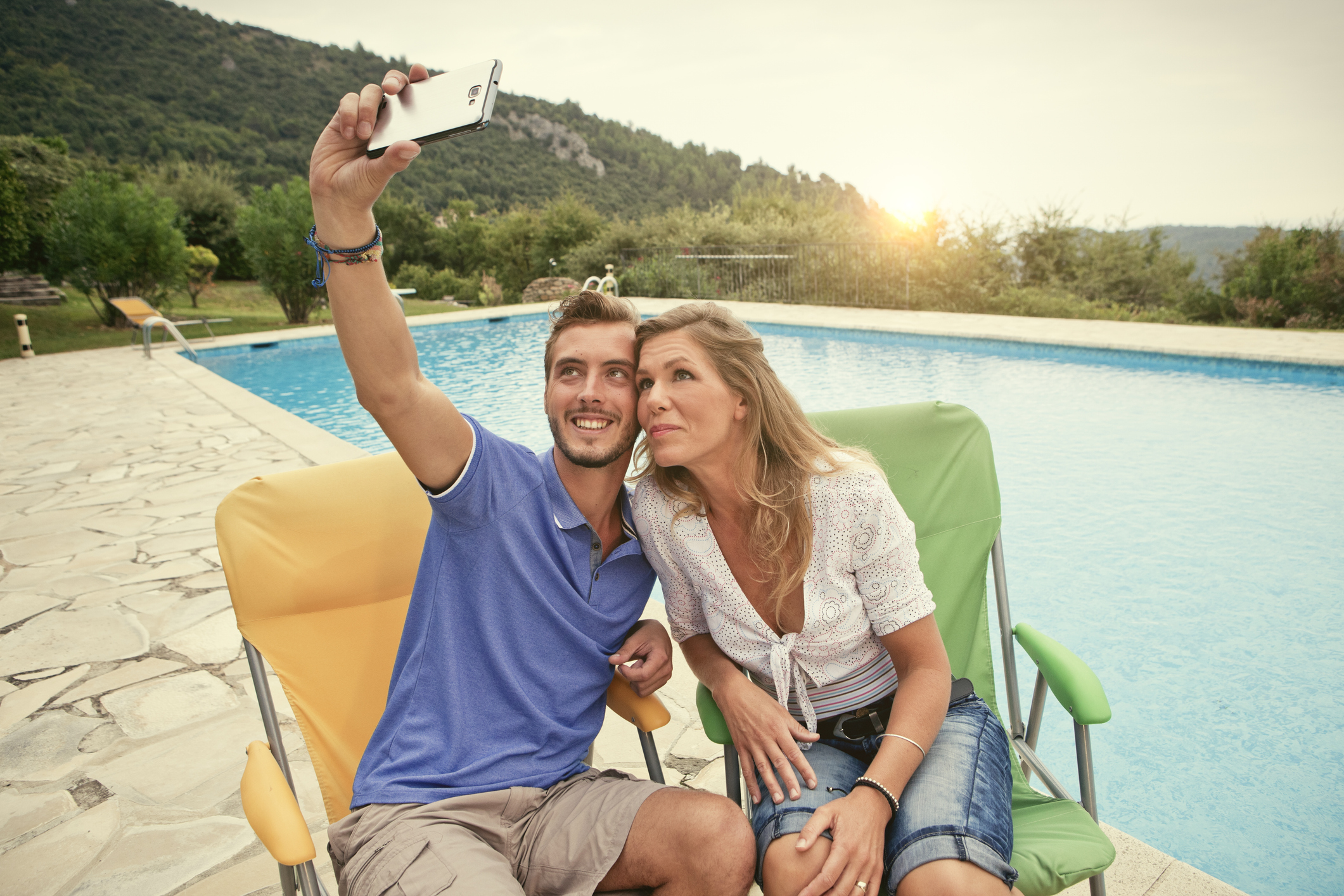 Couple on Holiday taking a selfie in france Pamela Anderson in Baywatch