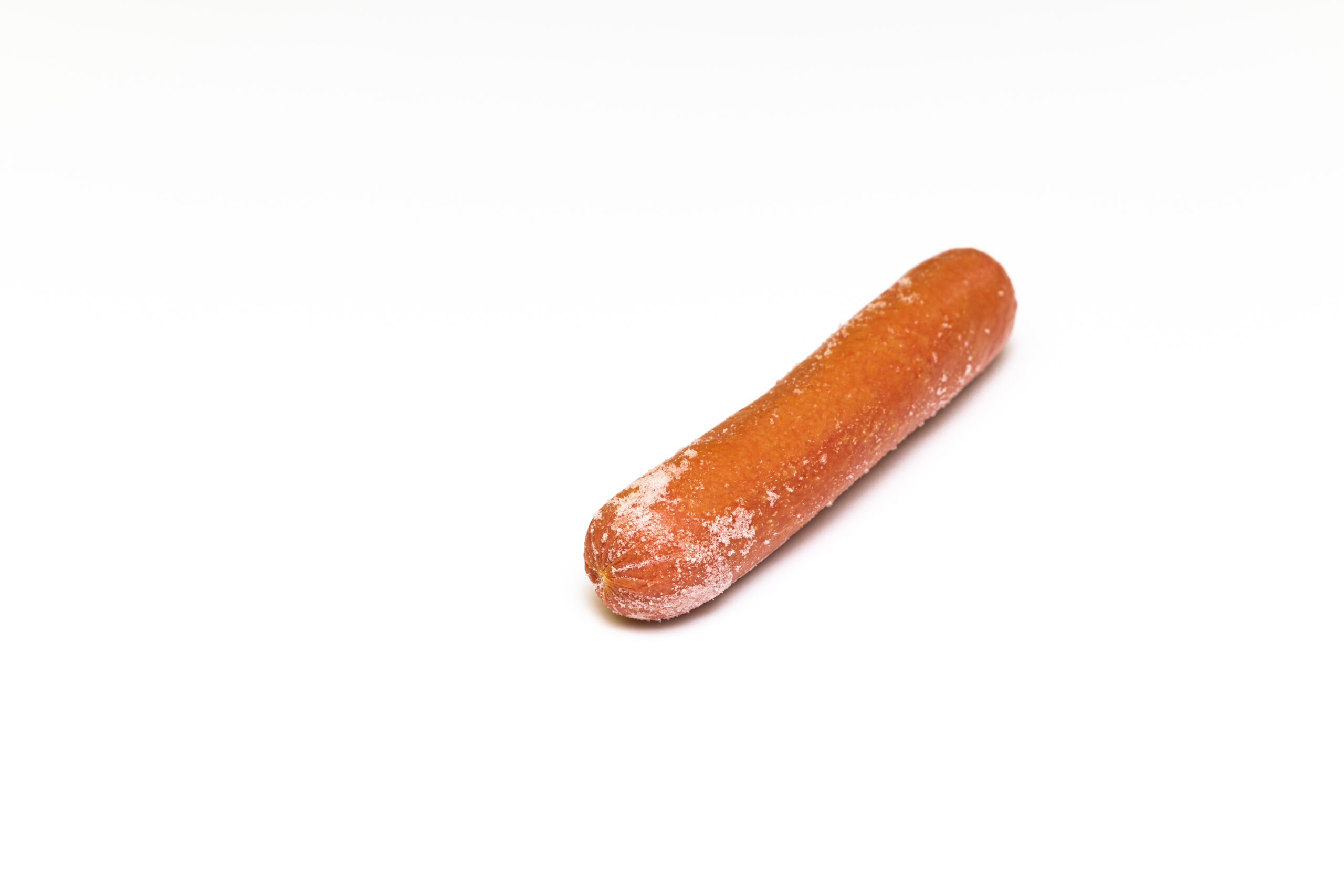frozen sausage with traces of frost on a white background. hot dog sausage xkwx sausage,
