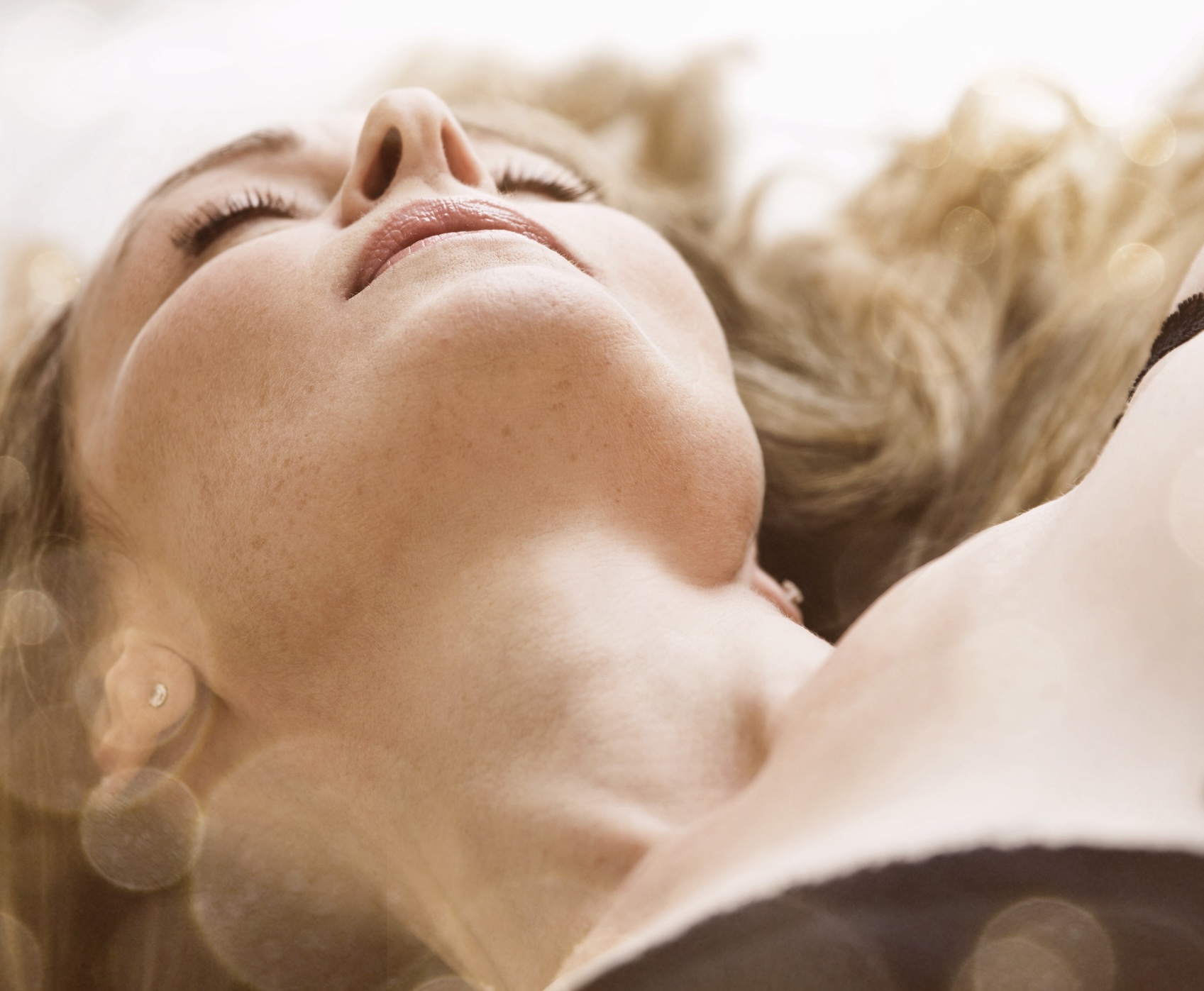 woman in lingerie resting with eyes closed Woman