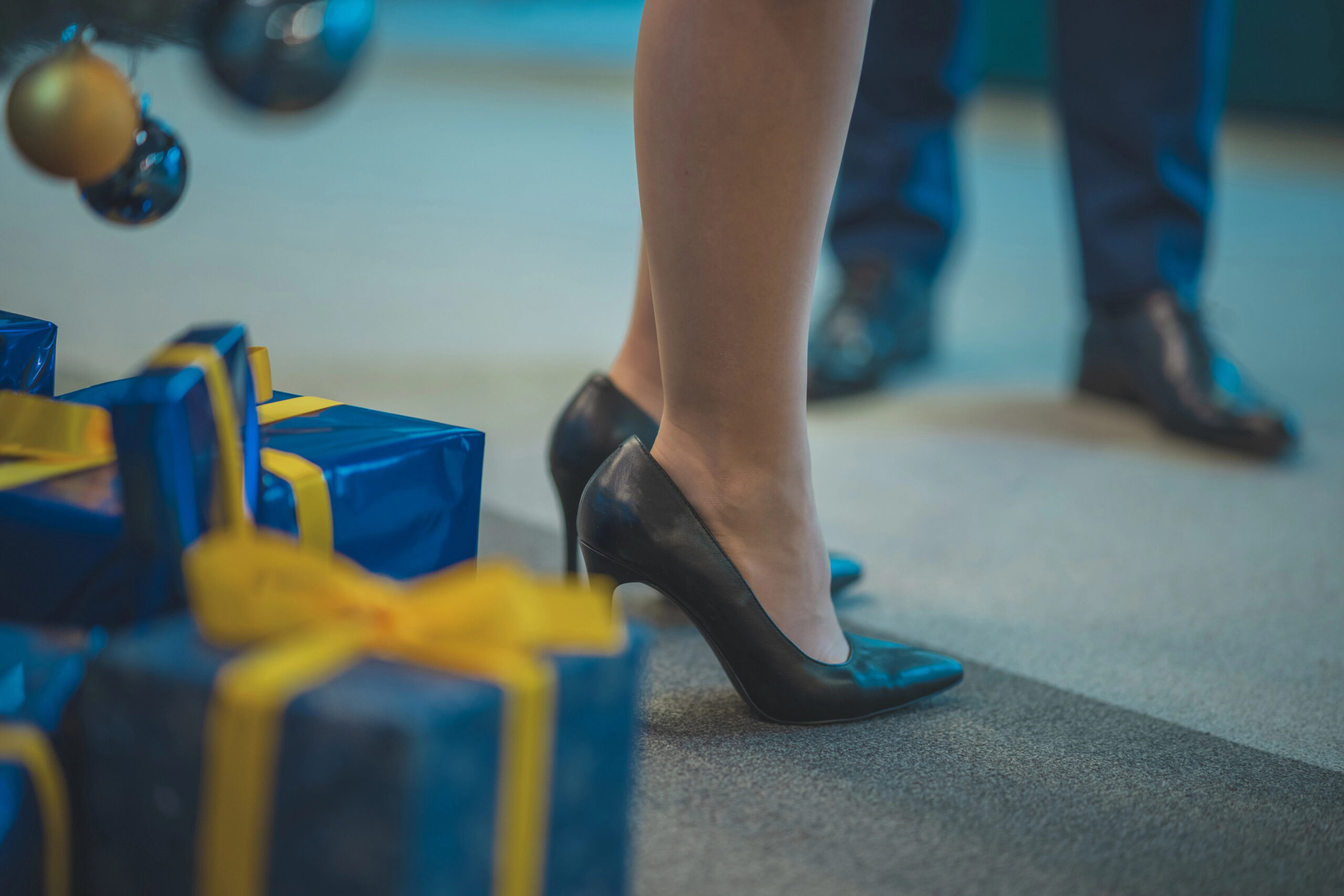 Sugar daddy bringing gifts to a sexy female in high heels. Concept of gifting women for sexual excha sugar baby