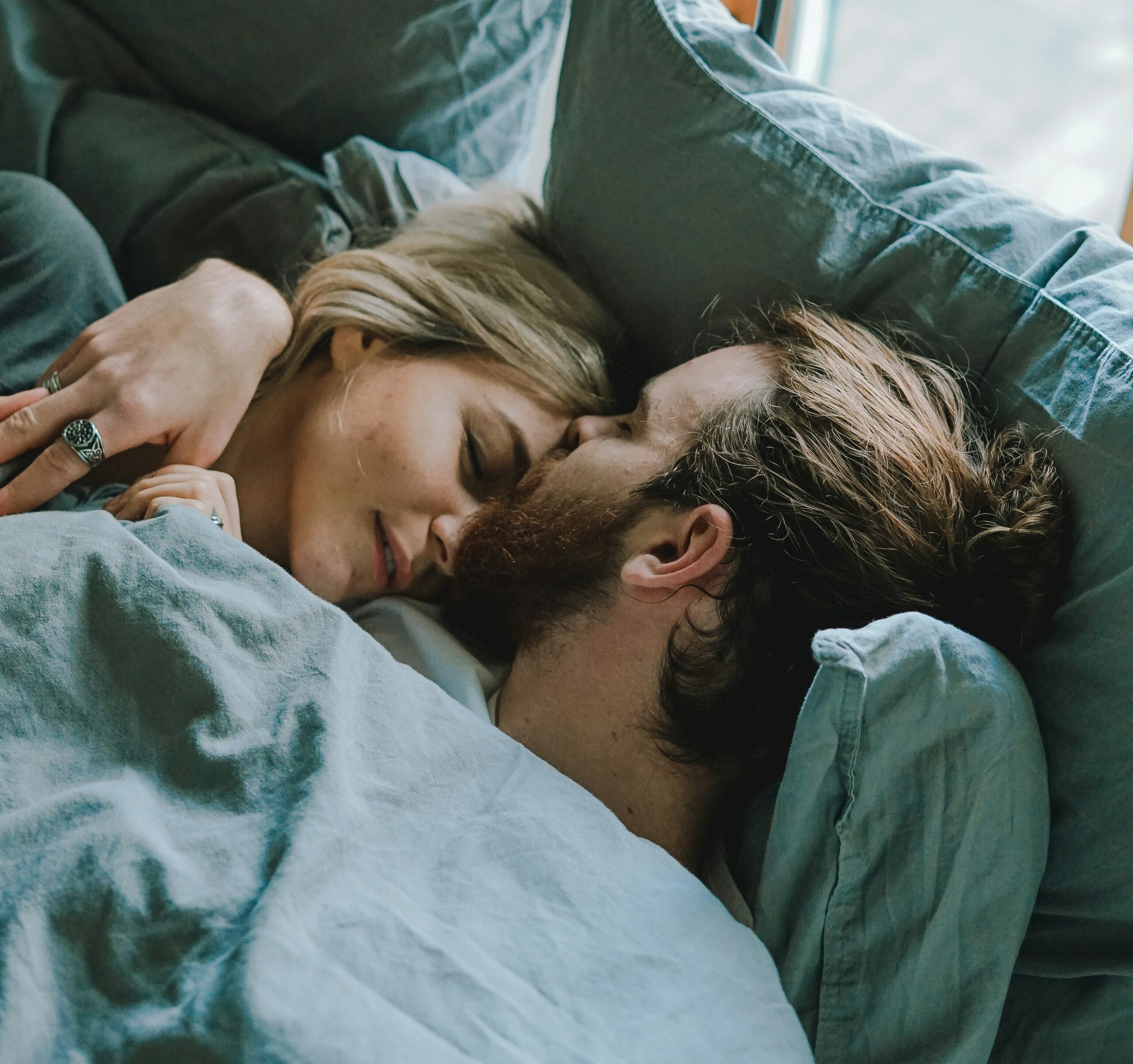 toa-heftiba-2ey7dmVEQv4-unsplash Man and woman in bed