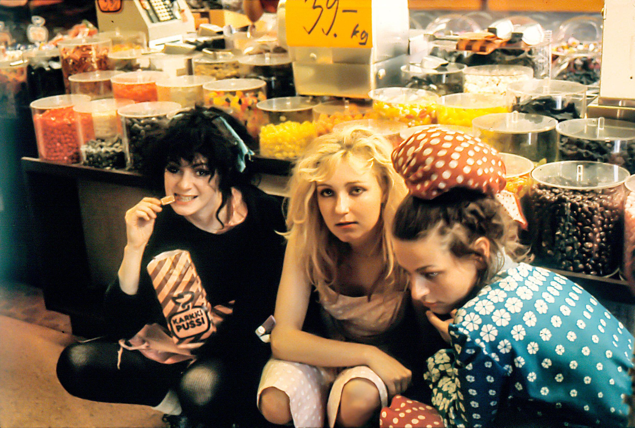 THE SLITS 1980 (Finland) in a sweetshop. Tessa Pollitt, Ari-up and Viv Albertine after releasing "In the Beginning there was rhythm" on Y records.