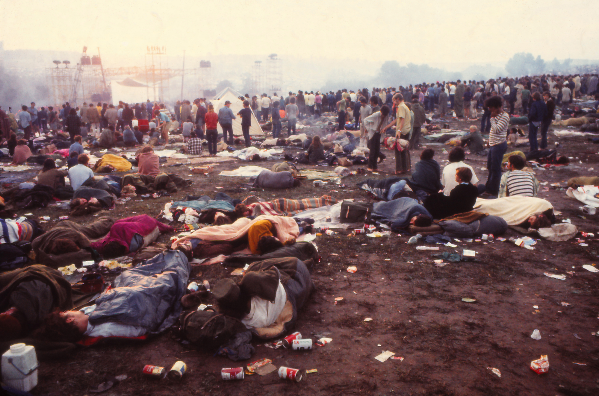 Woodstock Music Festival, 1969 People sleeping and relaxing in the messy field at the Woodstock Music Festival, 1969