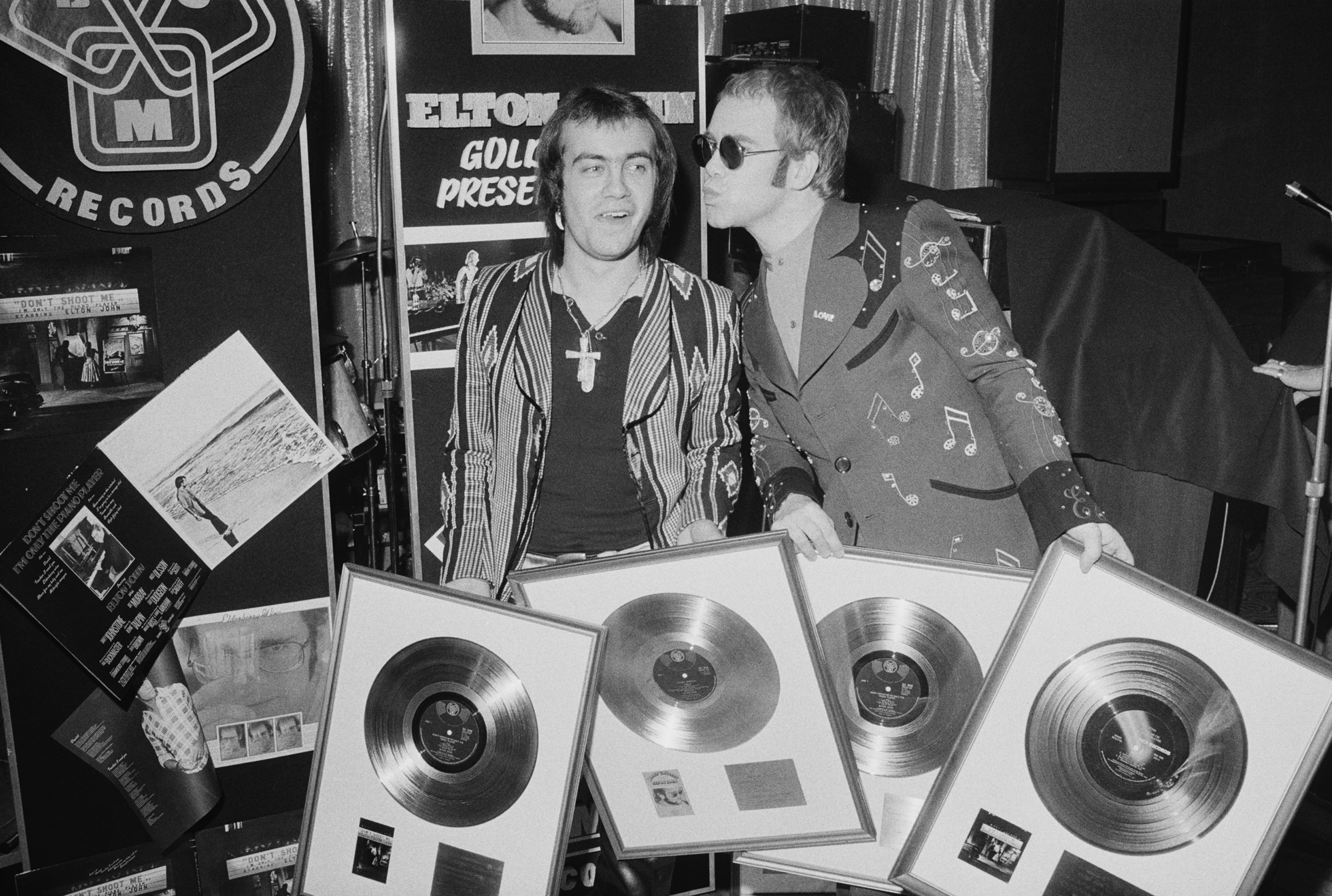 Gold Disc Recipients Elton John with his songwriting collaborator Bernie Taupin at a ceremony to award them gold discs for four of their co-written albums