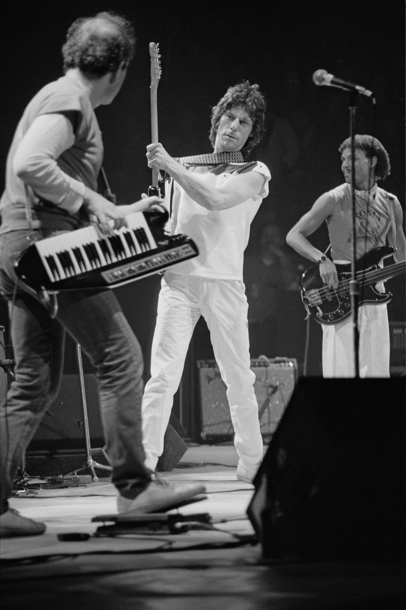 Jan Hammer playing keyboards supported by guitarist and songwriter Jeff Beck playing at the Ronnie Lane ARMS Benefit Concert at Madison Square Garden in New York